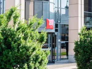 a building with a ups sign in front of it at Ibis Warszawa Stare Miasto in Warsaw