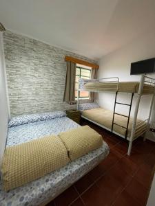 Кровать или кровати в номере Hotel Rural Juncalillo