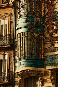 a building with a balcony on the side of it at FirstName Toulouse by Hyatt in Toulouse