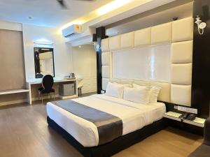 a bedroom with a bed and a desk and a chair at The Sterling Boutique Hotel Melaka in Malacca +37 photos