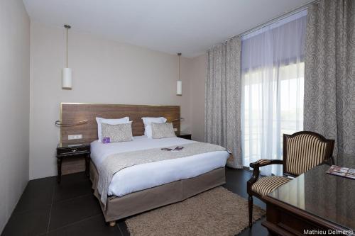 En eller flere senge i et værelse på Mercure Cayenne Royal Amazonia