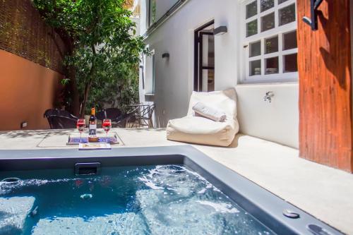 a hot tub on the patio of a house at SV Acropolis Residence in Athens