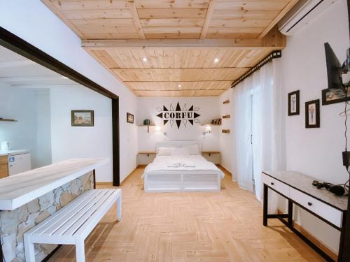 Villa Tasos tesisinde bir odada yatak veya yataklar