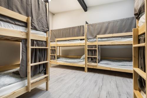 a room with four bunk beds in a room at Regem Hostel in Warszawa
