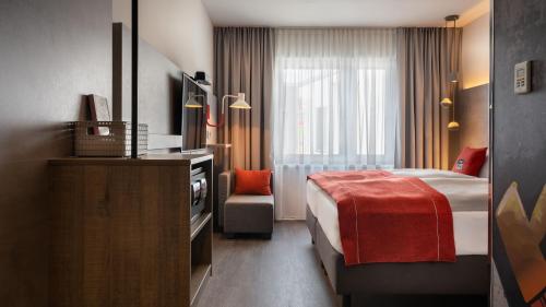 Rúm í herbergi á Holiday Inn - the niu, Hide Berlin Friedrichshain by IHG