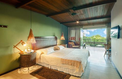 Cama ou camas em um quarto em Hotel Ponta do Madeiro