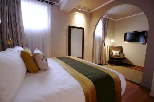 Katil atau katil-katil dalam bilik di Quiral Hotel Boutique